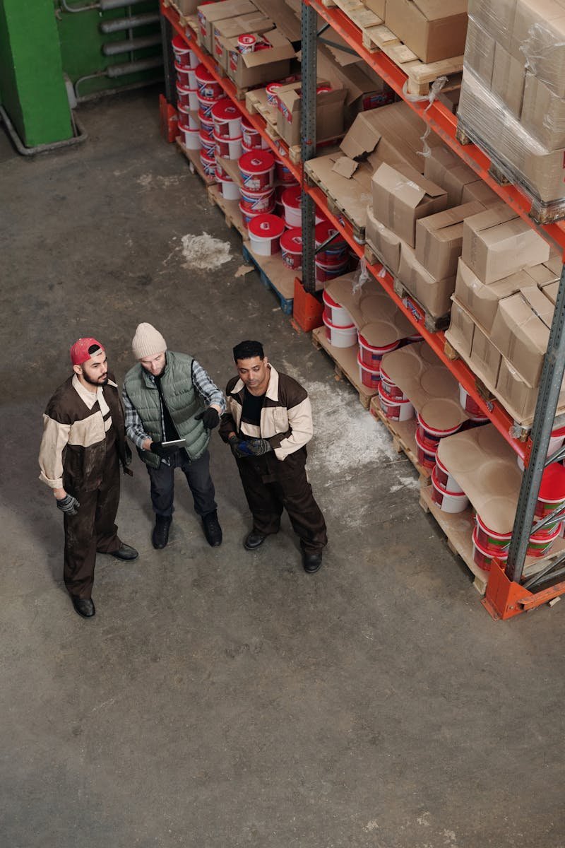 OEM packaging with drums, cartons, and palletized goods in warehouse